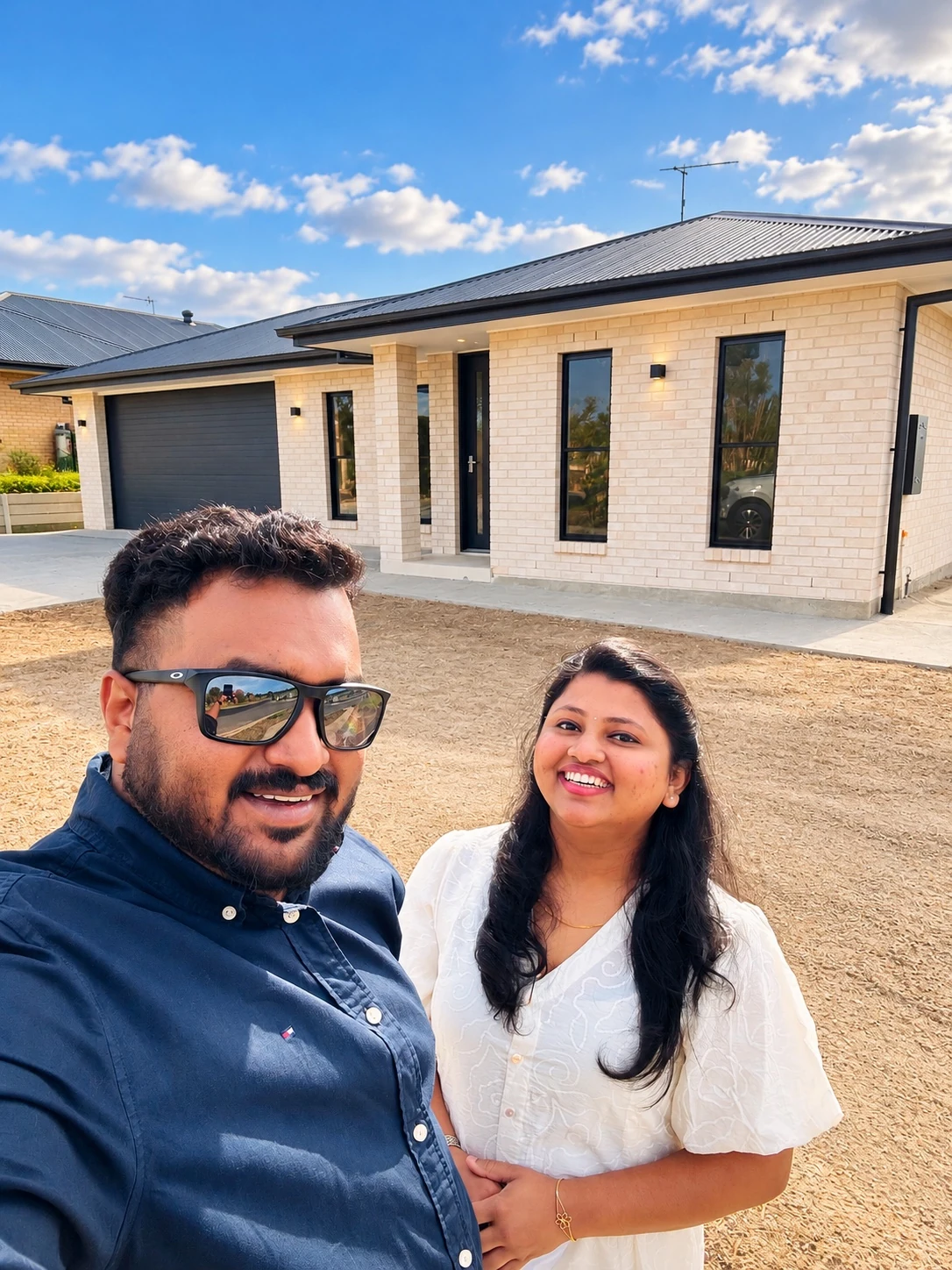 Sherin and Dibiya outside their completed home